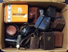 A large box of cameras and other camera equipment,