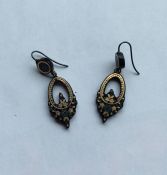 A pair of gold piqué drop earrings inset with flow