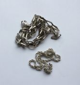 A silver fancy link guard chain together with one