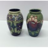 A matched pair of Moorcroft baluster shaped vases