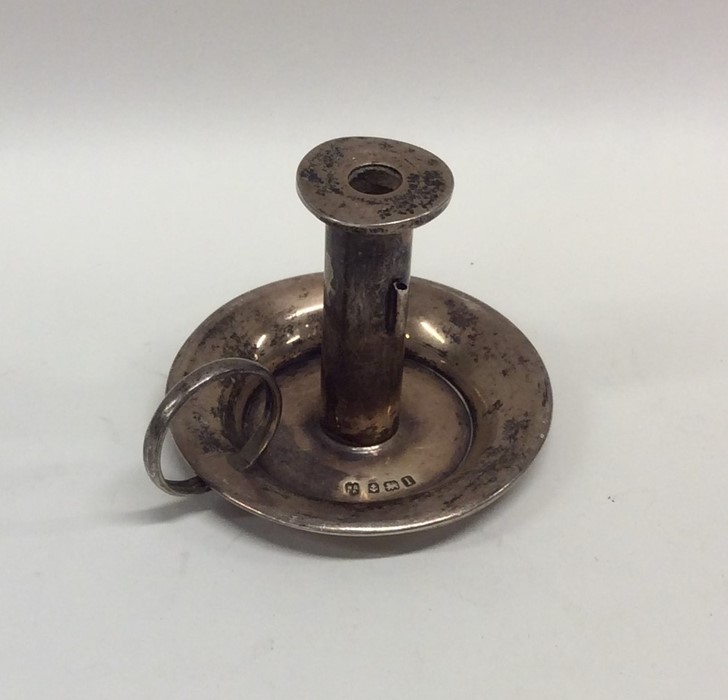 A circular miniature silver chamber stick. Birming