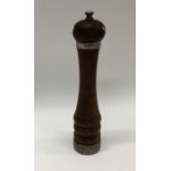 A tall silver mounted mahogany pepper grinder. Est