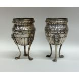 A good pair of Italian silver vases on three sprea