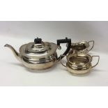 A silver plated three piece tea service. Est. £10