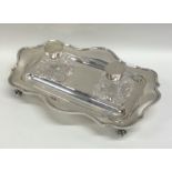 A lady's silver two bottle inkstand with shaped be