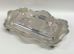 A lady's silver two bottle inkstand with shaped be