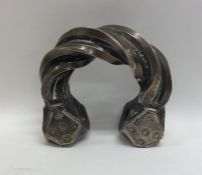A heavy Continental silver bangle with twisted des