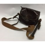 An old leather cartridge bag. Est. £20 - £30.