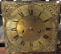 A brass mounted grandfather clock face. By John Ro