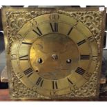 A brass mounted grandfather clock face. By John Ro