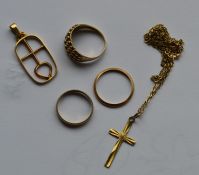 Three gold rings together with a pendant on chain.