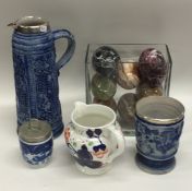 A German pottery Stein together with other items.