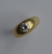 A good diamond single stone gypsy set ring in 18 c