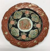 An Antique Imari circular dish with floral decorat