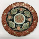 An Antique Imari circular dish with floral decorat