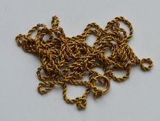 A 9 carat rope twist gold guard chain with ring cl