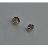 A pair of unmounted diamonds. Approx. 0.35 carats.