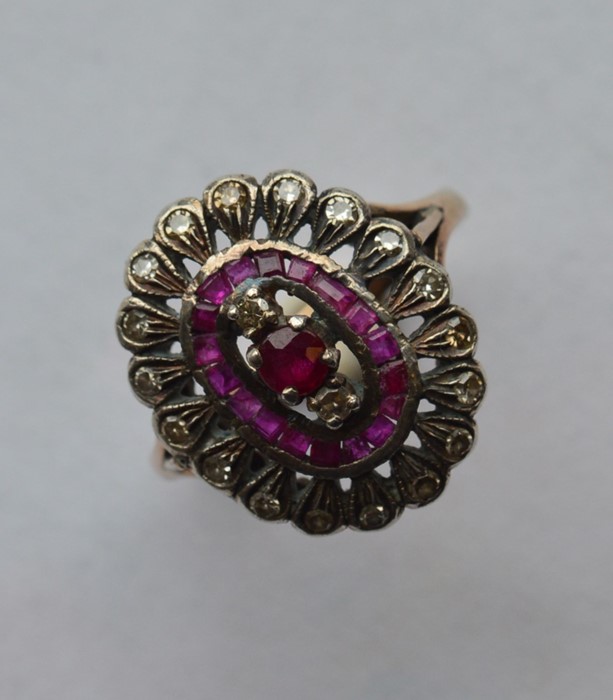 A French ruby and diamond cluster ring in two colo