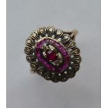 A French ruby and diamond cluster ring in two colo