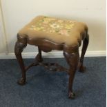 A Georgian style stool with slip-in seat and stret