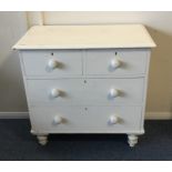 A pine chest of four drawers on turned supports. E