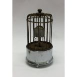 An unusual miniature alarm clock in the form of a