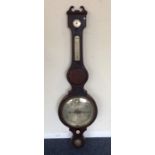 A banjo barometer with silvered dial and swan neck