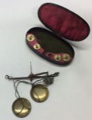 A Georgian cased miniature set of brass pan scales