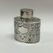 An Edwardian half fluted silver tea caddy. Sheffie