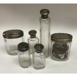 A group of cut glass and silver mounted dressing t