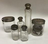 A group of cut glass and silver mounted dressing t