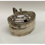 An oval Georgian silver drum mustard with hinged t
