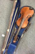 An old violin in case with bow. By Joan Carol Kloz