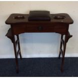 An Edwardian mahogany sewing table. Est. £25 - £35