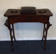 An Edwardian mahogany sewing table. Est. £25 - £35