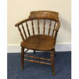 A old oak smoker's bow back chair on turned suppor