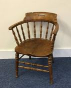 A old oak smoker's bow back chair on turned suppor