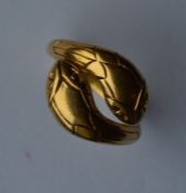 A stylish gold double head snake ring with texture