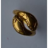 A stylish gold double head snake ring with texture