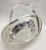 A Georgian silver oval fruit basket with reeded ha