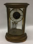 A large French oval mantle clock with white enamel