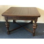 An oak drawer leaf table with stretcher base. Est.