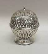 An unusual silver string box with pierced body to