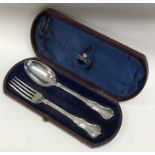 A cased silver two piece christening set. London.