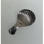 A good Georgian silver fluted caddy spoon with bri