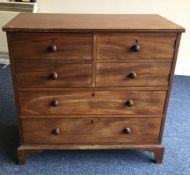 A Georgian mahogany two drawer and two door cupboa