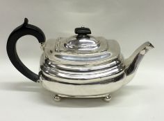 A George III silver teapot on ball feet. London 18