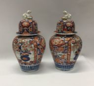 A pair of Japanese 19th Century Imari vases and co