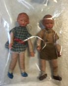 Two miniature vintage dressed German dolls, one a