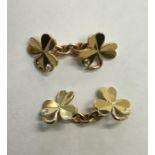 A pair of Irish clover cufflinks inset with diamon